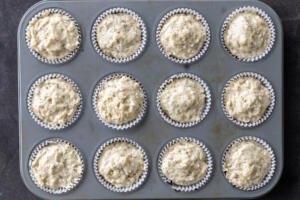 Muffin batter added to the muffin pan.
