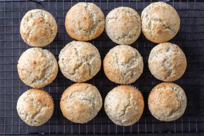 Baked Lemon Poppy Seed Muffins on a cooling rack.