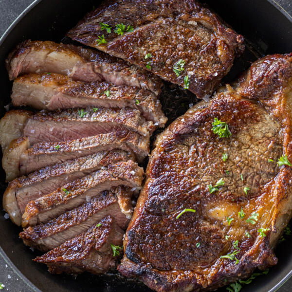 Reverse Sear Steak sliced on a pan.