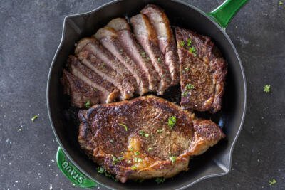 Reverse Sear Steak on a pan, some of it sliced.