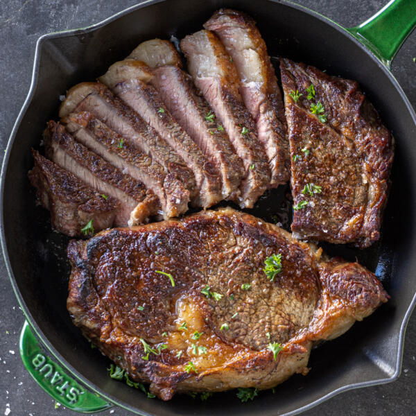Reverse Sear Steak on a pan, some of it sliced.