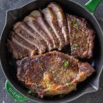 One piece sliced steak in a pan.