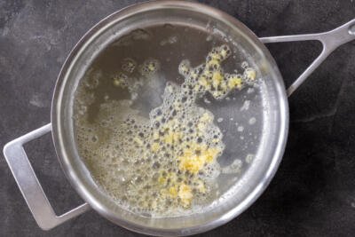 Butter cooking with garlic.