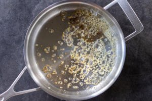 Butter with garlic in a pan.
