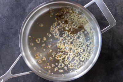 Butter with garlic in a pan.