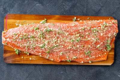 Salmon with herb butter on a cedar plank.
