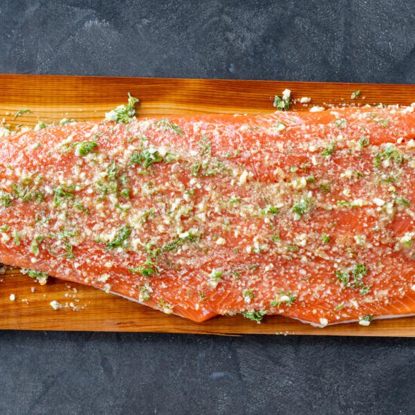Salmon with herb butter on a cedar plank.