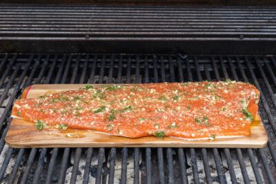 Cedar Plank Salmon on a grill.