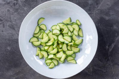 Cucumbers sliced in a bowl.