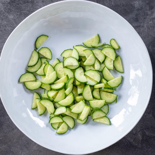 Cucumbers sliced in a bowl.