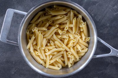 Cooked Penne in a pot.