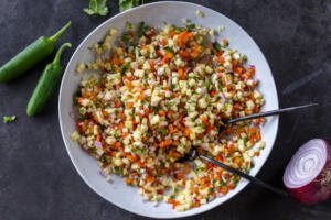 Fresh Pineapple Salsa with serving spoons.