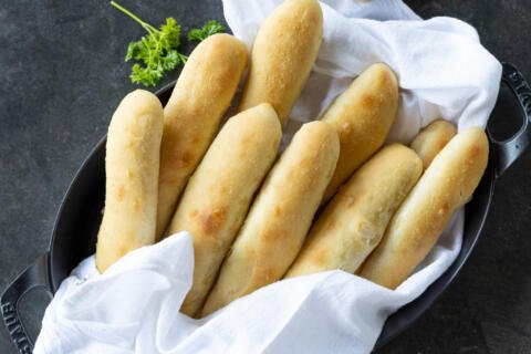 Baked Olive Garden Breadsticks in a towel.