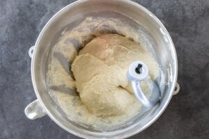 Kneaded dough in a mixing bowl.