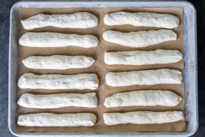 Olive Garden Breadsticks before baking on a baking sheet.
