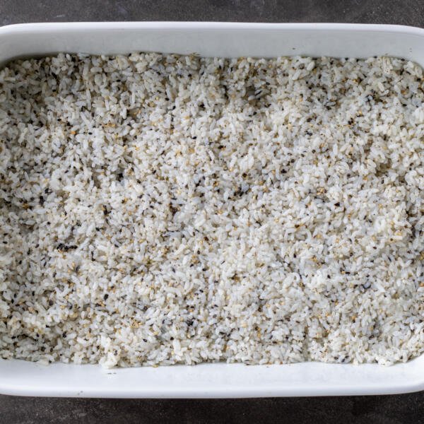 Sushi rice with Furikake in a baking pan.