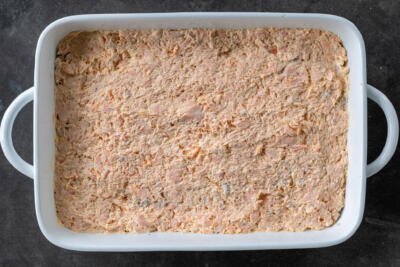Baking pan with salmon mixture in a pan.
