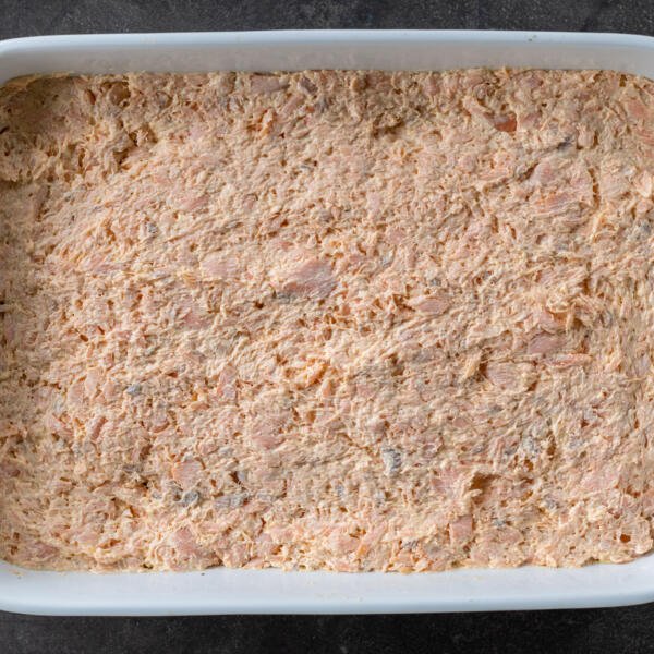 Baking pan with salmon mixture in a pan.