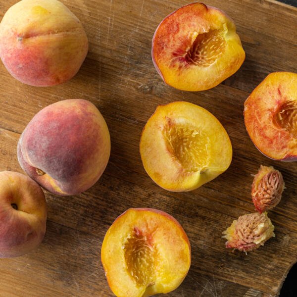 Sliced peaches open.