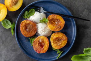 Air fryer peaches on a serving plate.