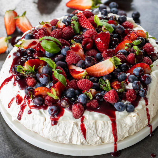 Pavlova with cream and berries.