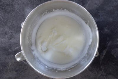 Whisked egg whites in a mixing bowl.