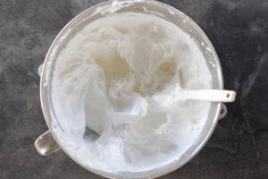 Whisked egg whites in a mixing bowl.