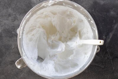 Whisked egg whites in a mixing bowl.