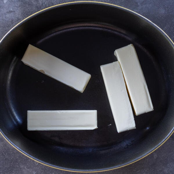 Butter in a pan.