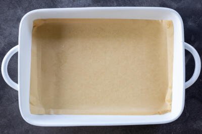 Lined baking pan with. parchment paper.
