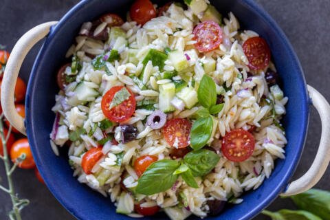 Greek Orzo Salad with Feta in a serving bowl.