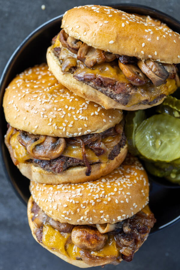 Messy burgers on a serving tray.