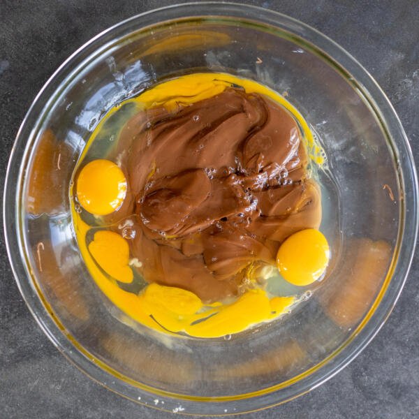Nutella and eggs in a bowl.