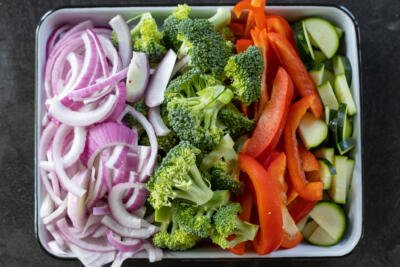 Sliced up veggies on a sheetpan.