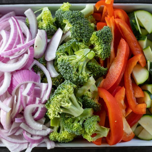 Sliced up veggies on a sheetpan.