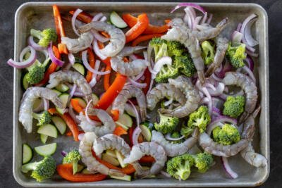 Sheet pan with veggies and shrimp.