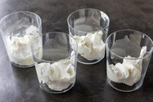 Yogurt inside a glass cup.