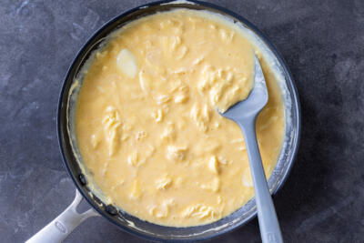Eggs cooking in a pan.