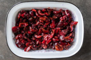 Cherries in a bowl chopped up.