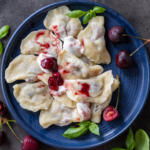 Cherry Vareniki on a serving plate.