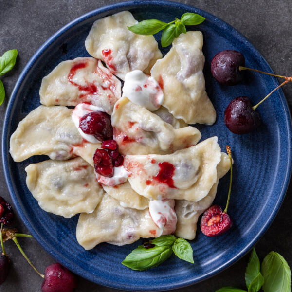 Cherry Vareniki on a serving plate.