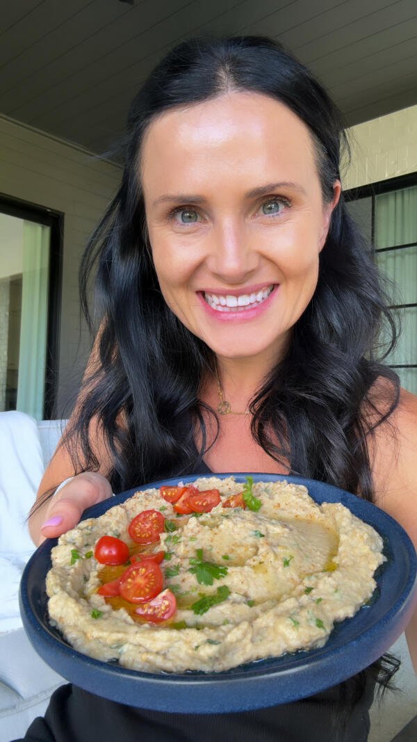 Natalya with a plate of Eggplant salad in hand.