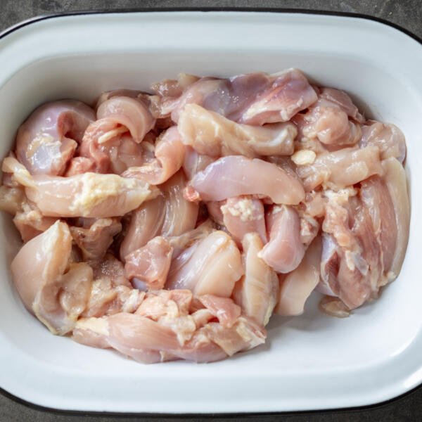 Sliced chicken in a bowl.