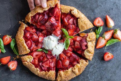 Strawberry Galette with berries around.