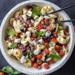 A bowl with Tortellini Pasta Salad .