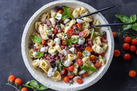 A bowl with Tortellini Pasta Salad .