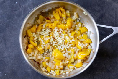 Cooking onion bell pepper and garlic.