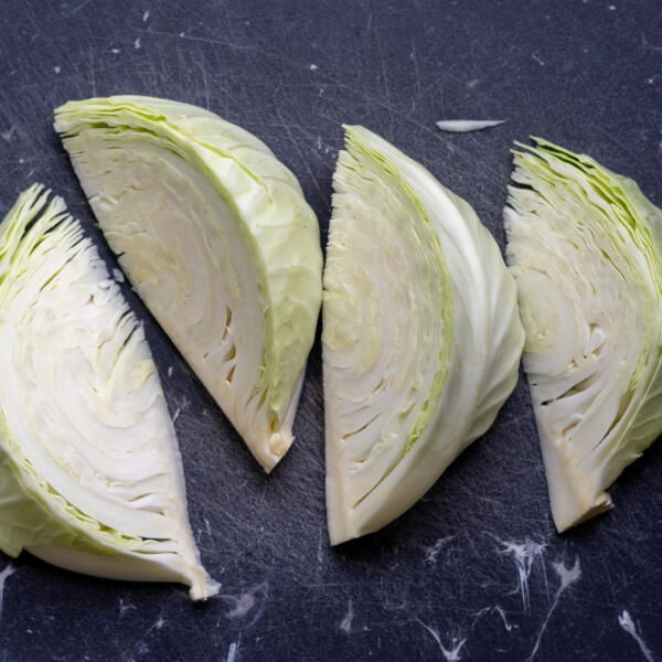 Cut up pieces of cabbage.