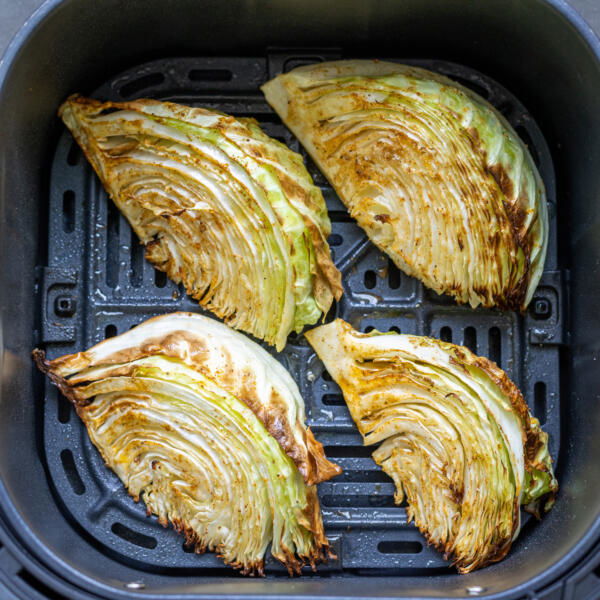 Air fryer Cabbage in an air fryer basket.