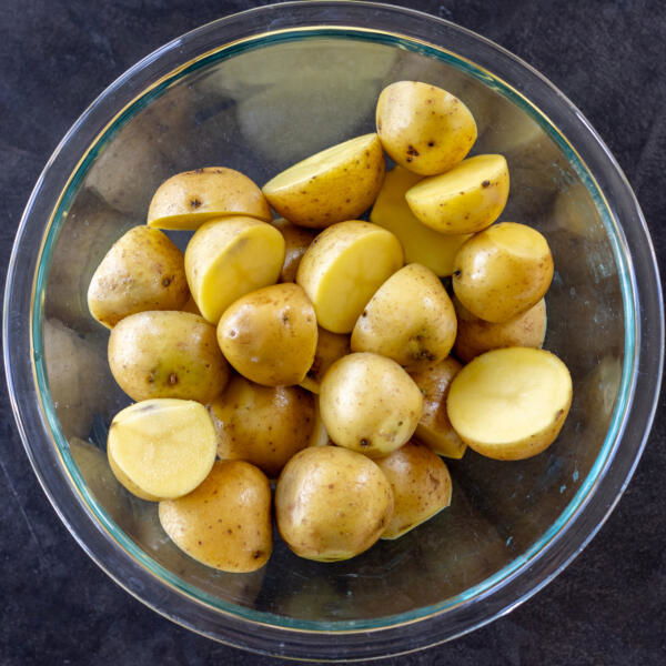 Sliced potatoes in a bowl.